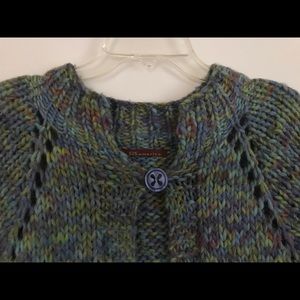 Hand knit sweater for layering look.